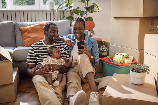 Young family with a baby settling into their new home