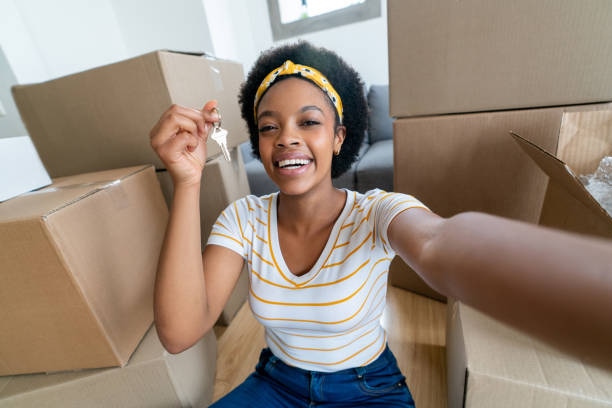 Woman holding the keys to her new house